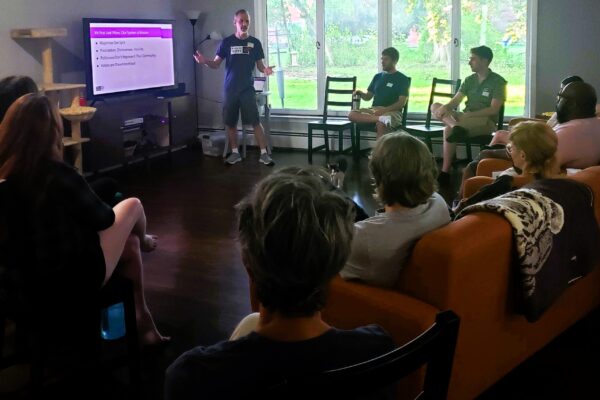 A speaker educates voters at a home in Redford